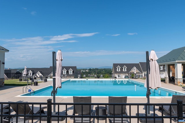 view of swimming pool featuring a patio area