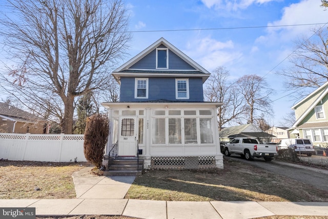 view of front of home featuring a sunroom