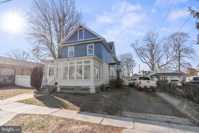 view of front of house with a sunroom