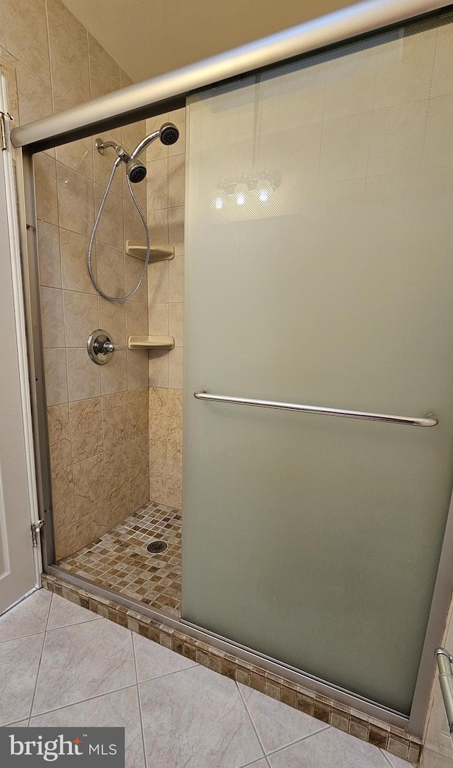 bathroom featuring tile patterned floors and walk in shower