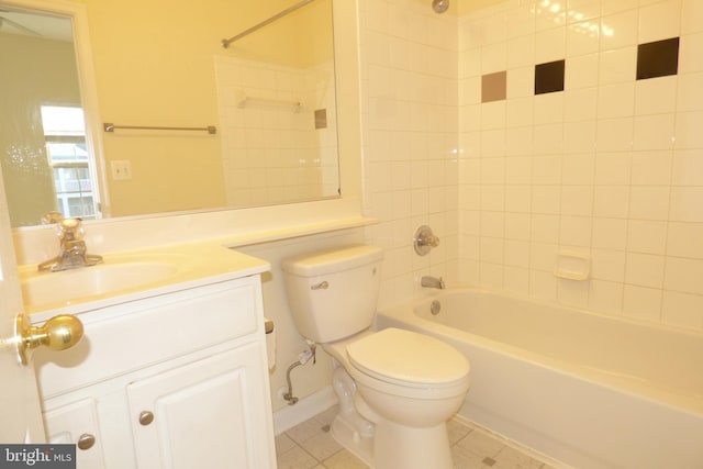 full bathroom featuring tiled shower / bath, vanity, toilet, and tile patterned flooring