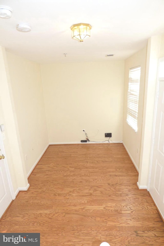 spare room featuring light hardwood / wood-style flooring