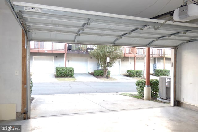 garage with central AC and a garage door opener