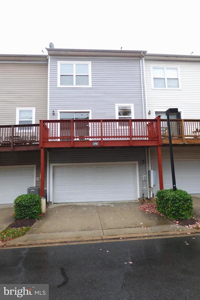 back of house with central AC unit