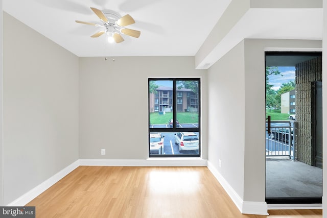 unfurnished room with ceiling fan and light hardwood / wood-style flooring