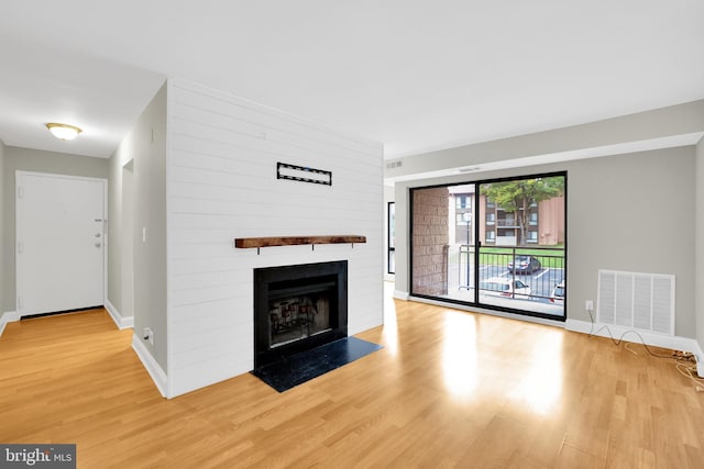 unfurnished living room featuring light hardwood / wood-style floors