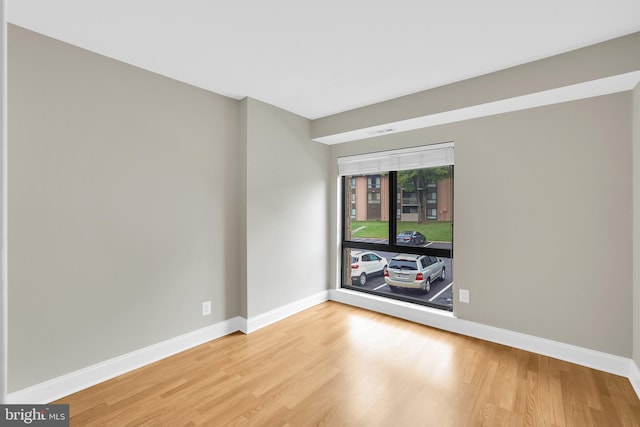 spare room featuring hardwood / wood-style floors