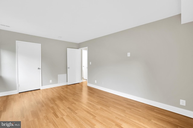 empty room with light wood-type flooring