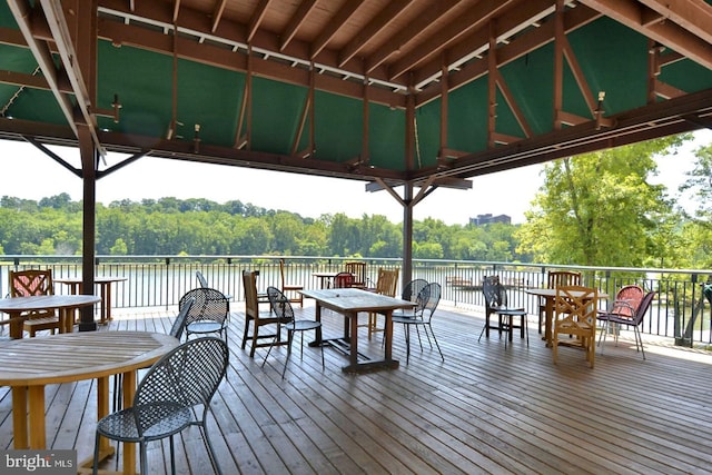 wooden deck with a gazebo and a water view