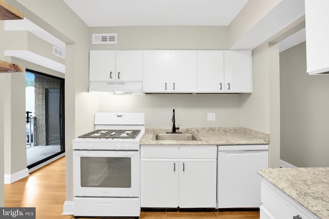 kitchen with white cabinetry, light wood-type flooring, white appliances, and sink