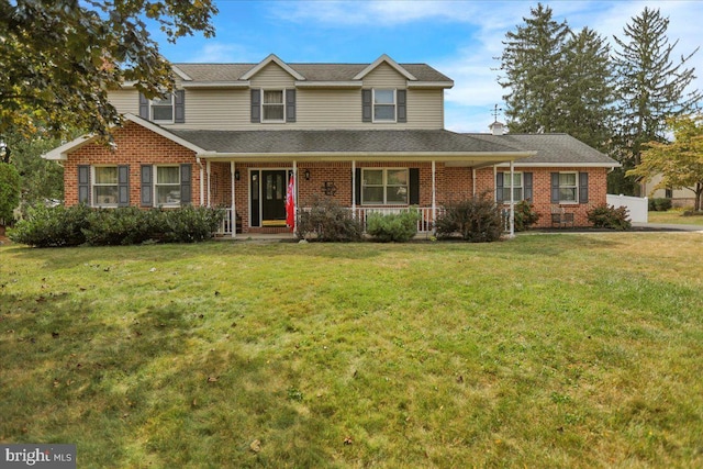 front of property with a front lawn and a porch