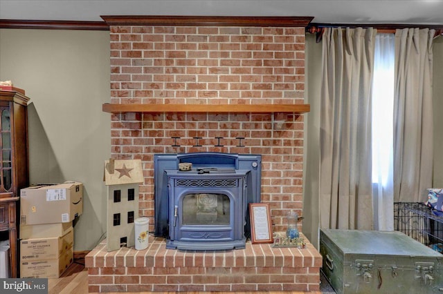 interior details featuring a wood stove and ornamental molding