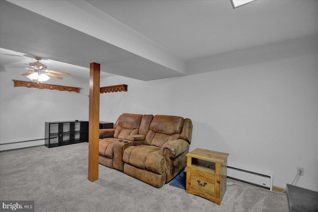 living room featuring baseboard heating, light carpet, and ceiling fan