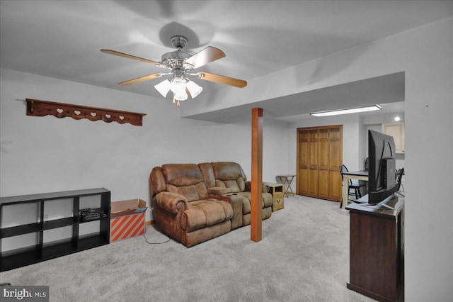 living room with ceiling fan and light carpet