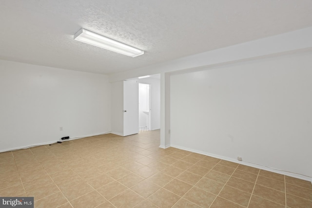 spare room featuring a textured ceiling