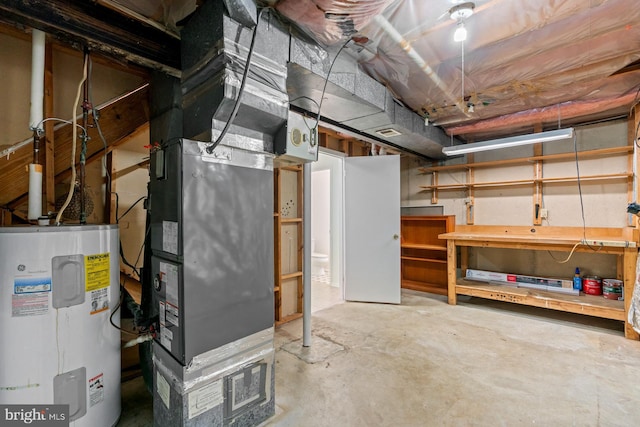 basement featuring heating unit and electric water heater