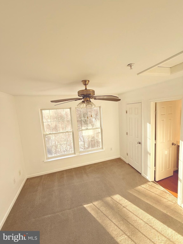 carpeted empty room with ceiling fan