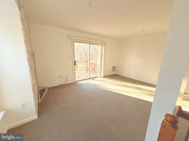 spare room featuring carpet flooring