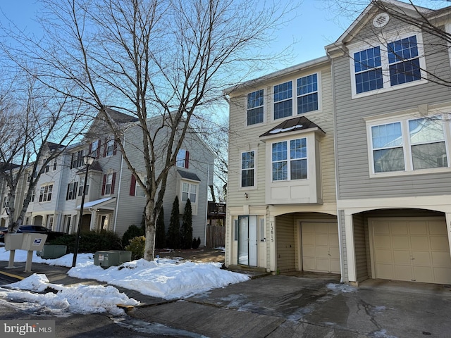 townhome / multi-family property featuring a garage