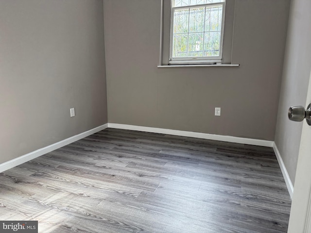 unfurnished room featuring wood-type flooring