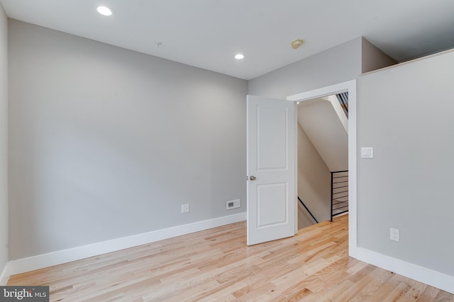 empty room with light hardwood / wood-style floors