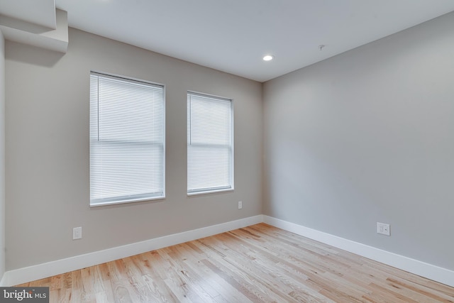 spare room featuring light wood-type flooring