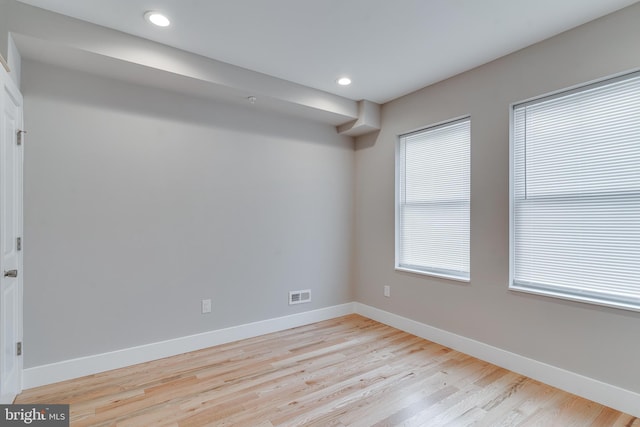 unfurnished room featuring light hardwood / wood-style flooring