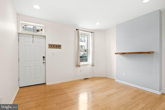 entrance foyer with baseboards, light wood-style flooring, and recessed lighting