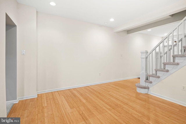 interior space featuring light wood-style floors, stairs, baseboards, and recessed lighting