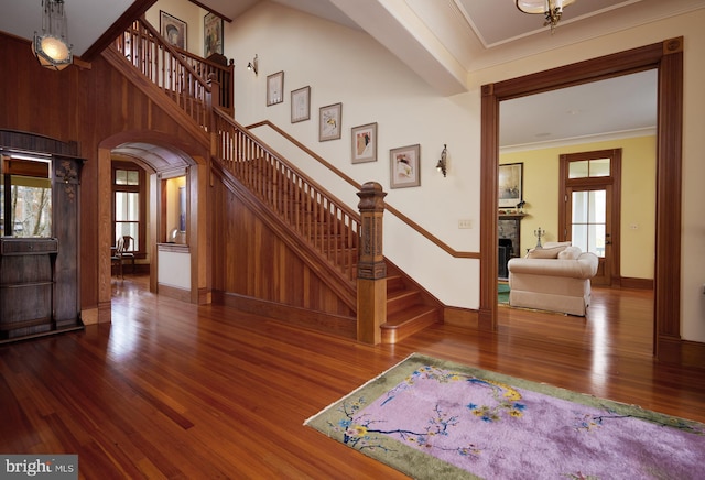 interior space featuring crown molding and hardwood / wood-style floors