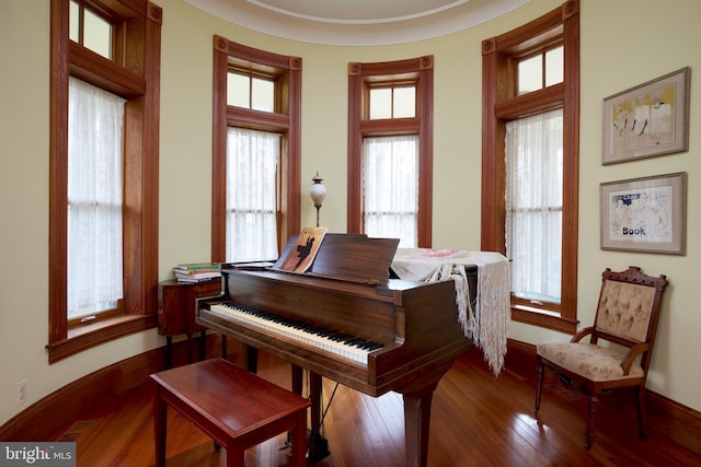 misc room featuring ornamental molding and hardwood / wood-style floors