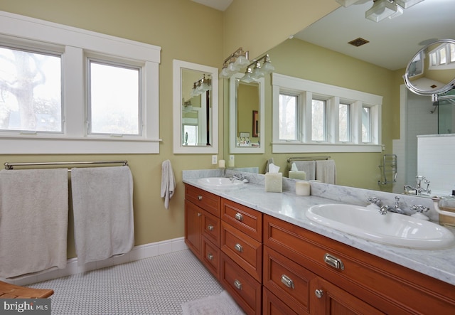 bathroom featuring tile patterned floors and vanity