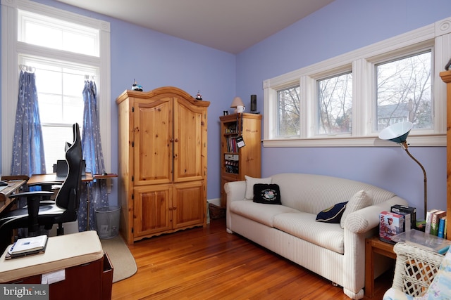 home office with light hardwood / wood-style floors