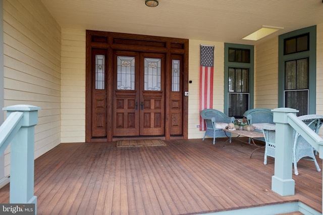 entrance to property featuring a porch