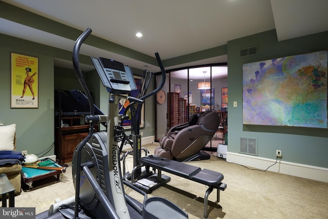 workout area featuring carpet flooring