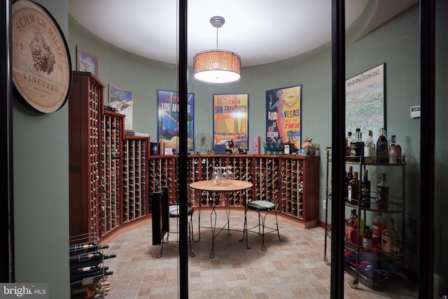 wine room featuring indoor bar