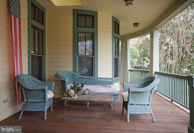 wooden terrace with a porch