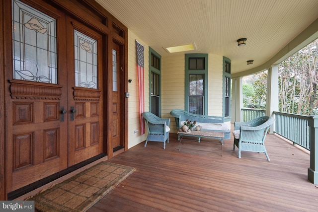 property entrance with covered porch