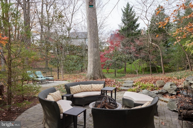 view of patio / terrace featuring an outdoor living space with a fire pit