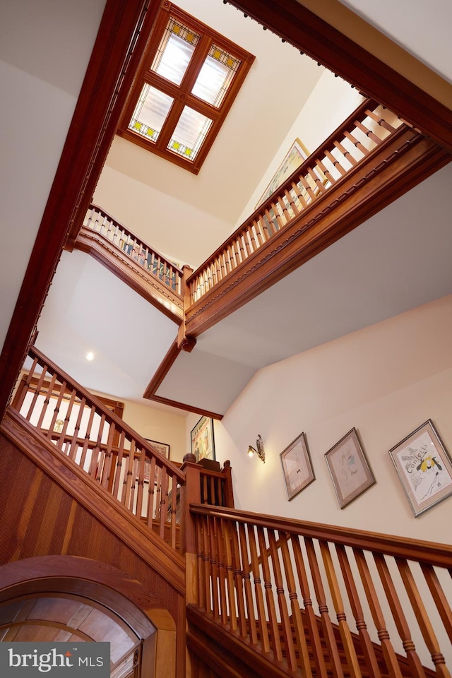 staircase featuring vaulted ceiling