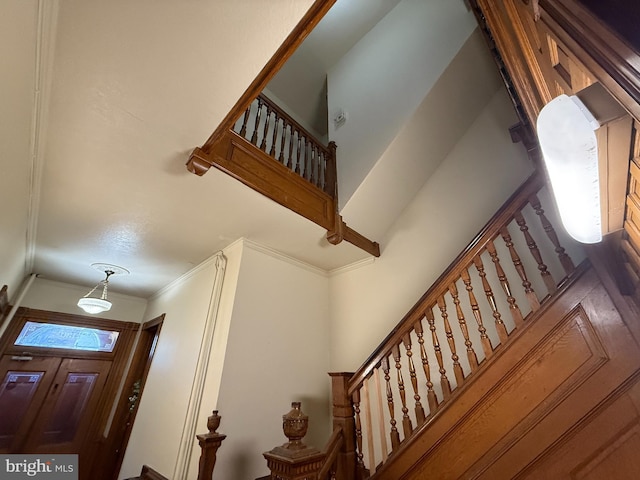 stairway with crown molding