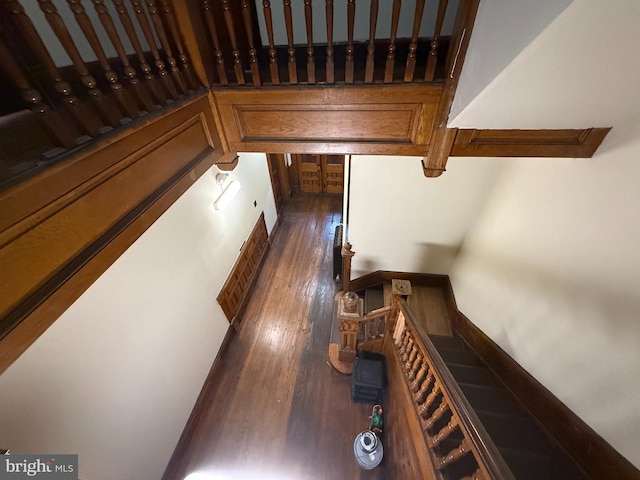 stairs with wood-type flooring