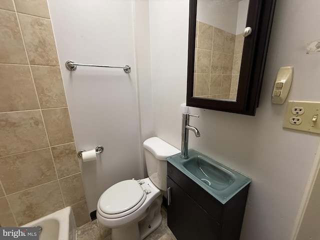 bathroom featuring a bath, vanity, and toilet