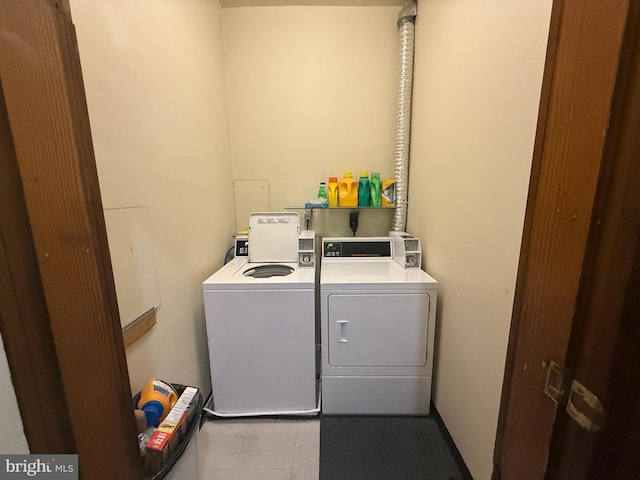 washroom featuring washing machine and dryer