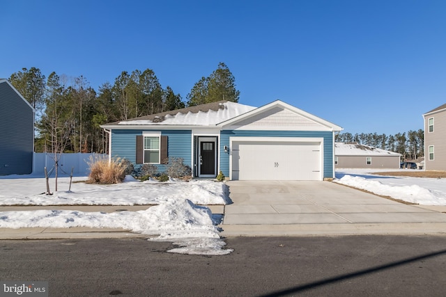 single story home featuring a garage