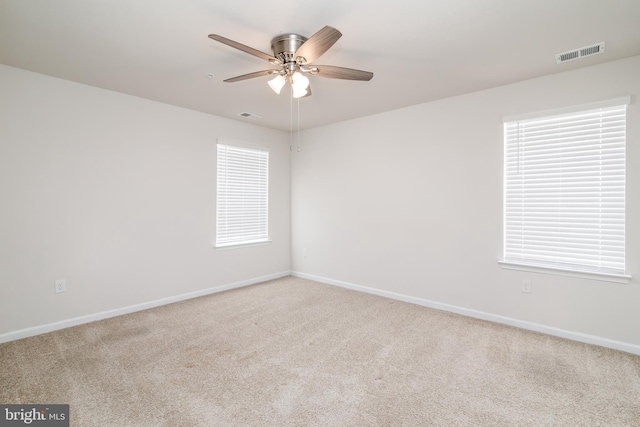 unfurnished room featuring carpet floors and ceiling fan