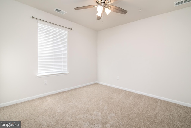 unfurnished room featuring carpet floors and ceiling fan