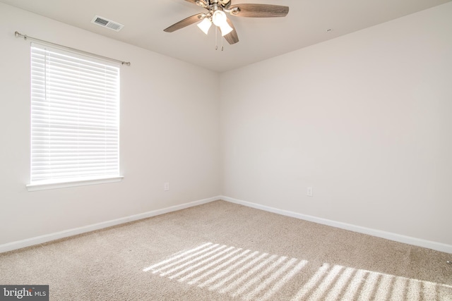 unfurnished room with ceiling fan and carpet flooring