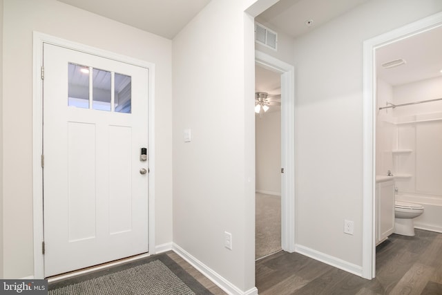 entryway with dark wood-type flooring