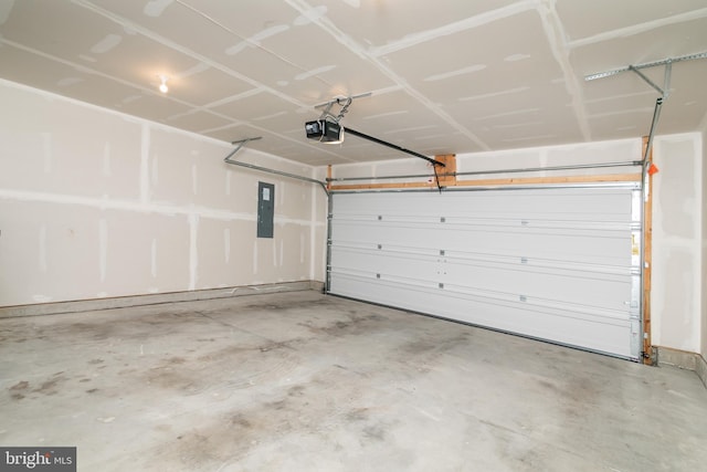 garage featuring electric panel and a garage door opener